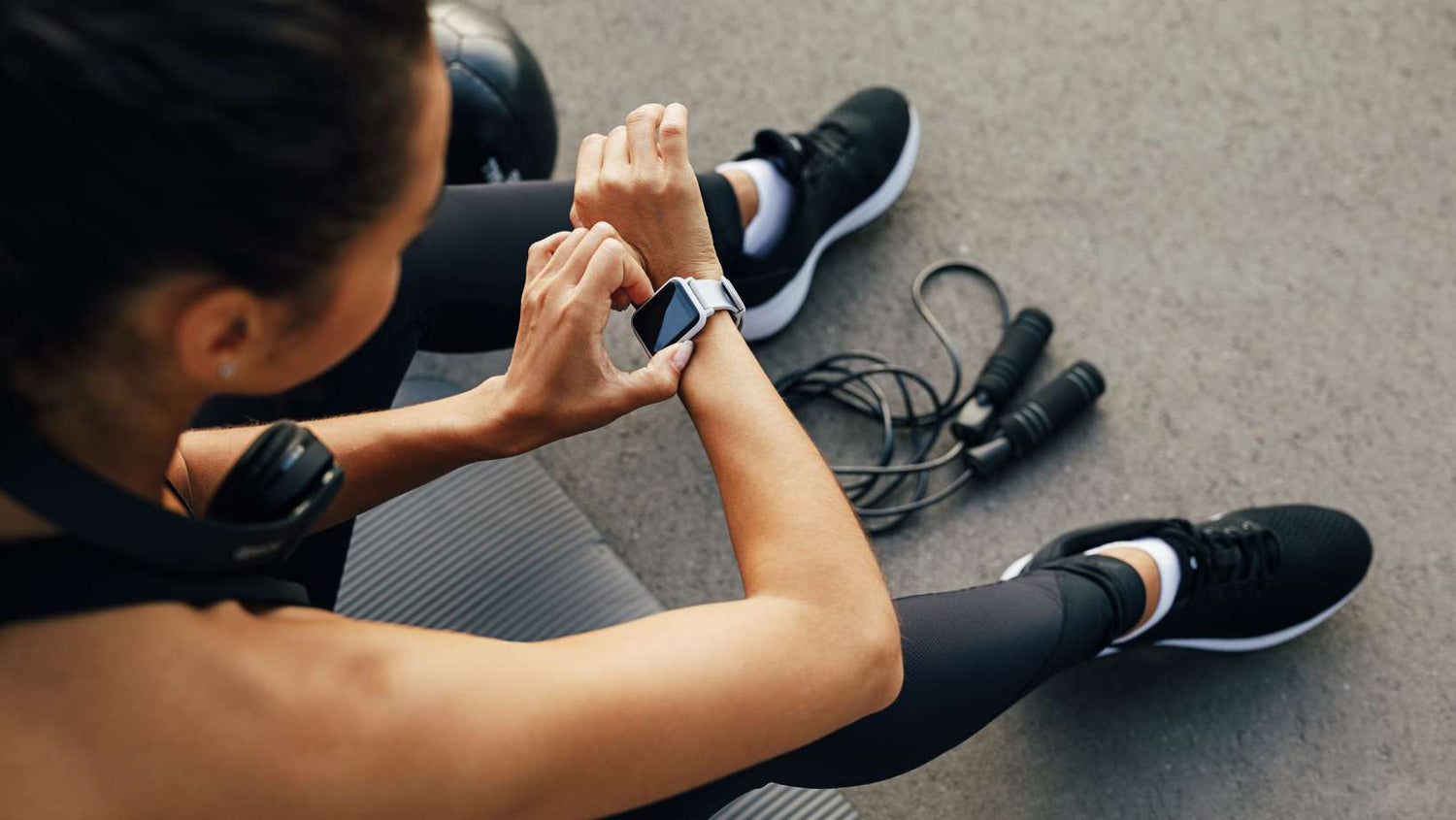 Fit Woman Looking at Smart Watch