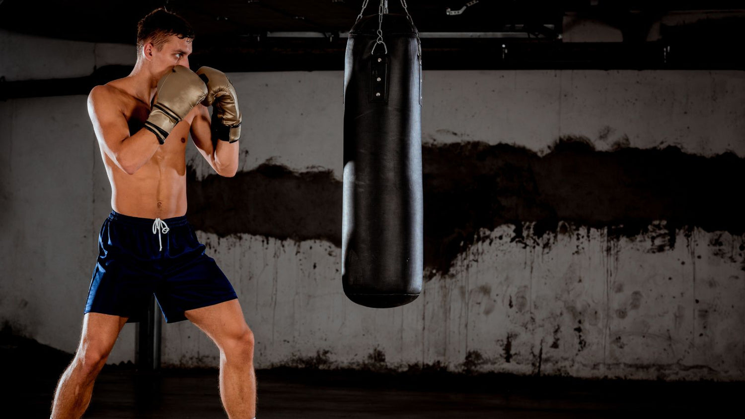 MMA fighter practicing punch on punching bag