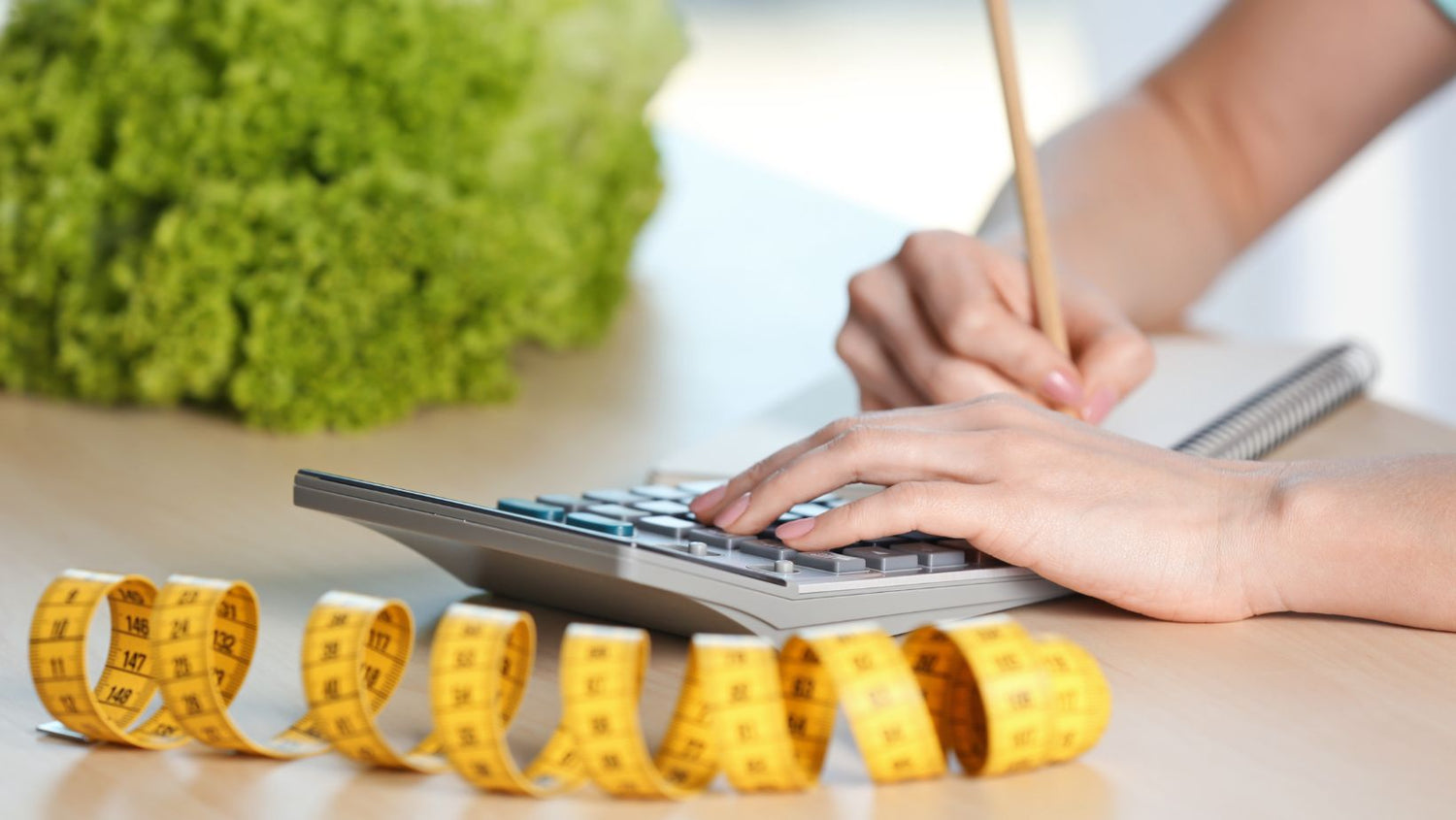 Young Woman Calculating Calories at Table