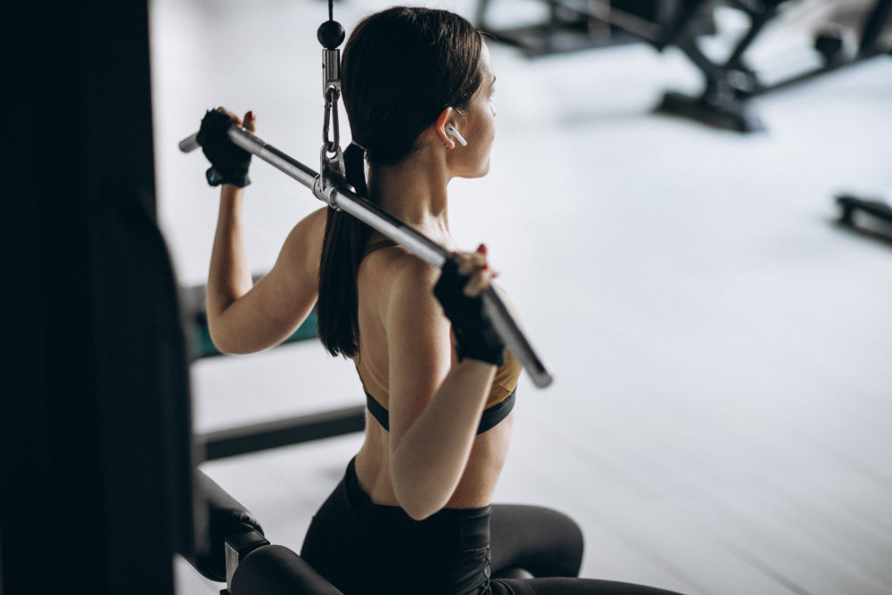 Young attractive woman exercising at the gym