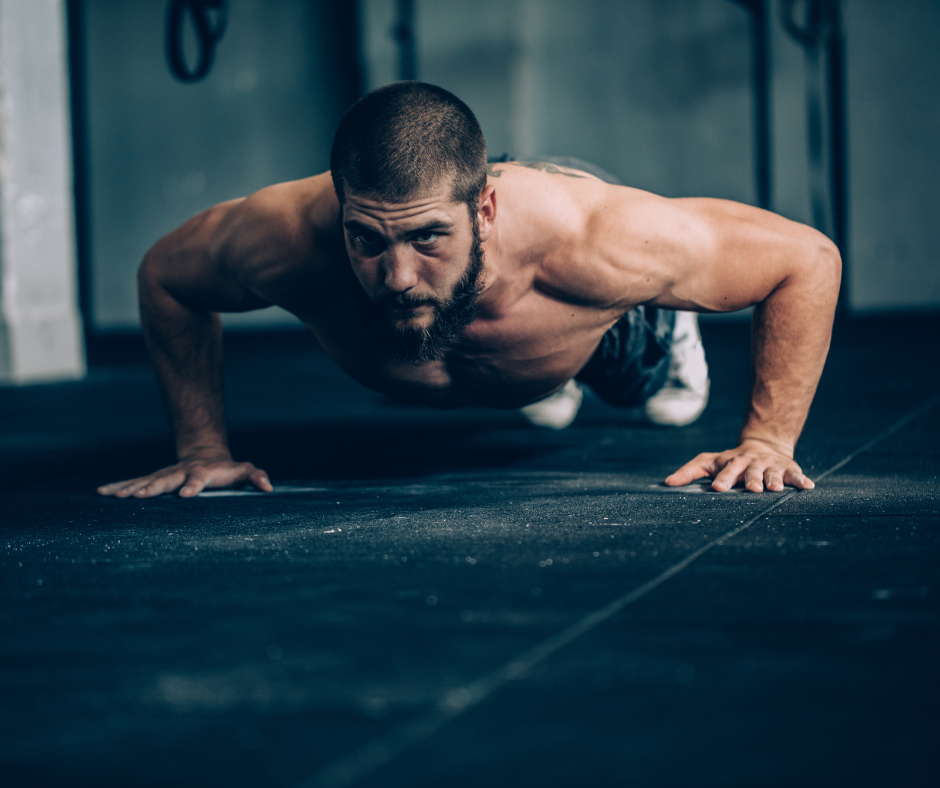 man doing plyo push ups